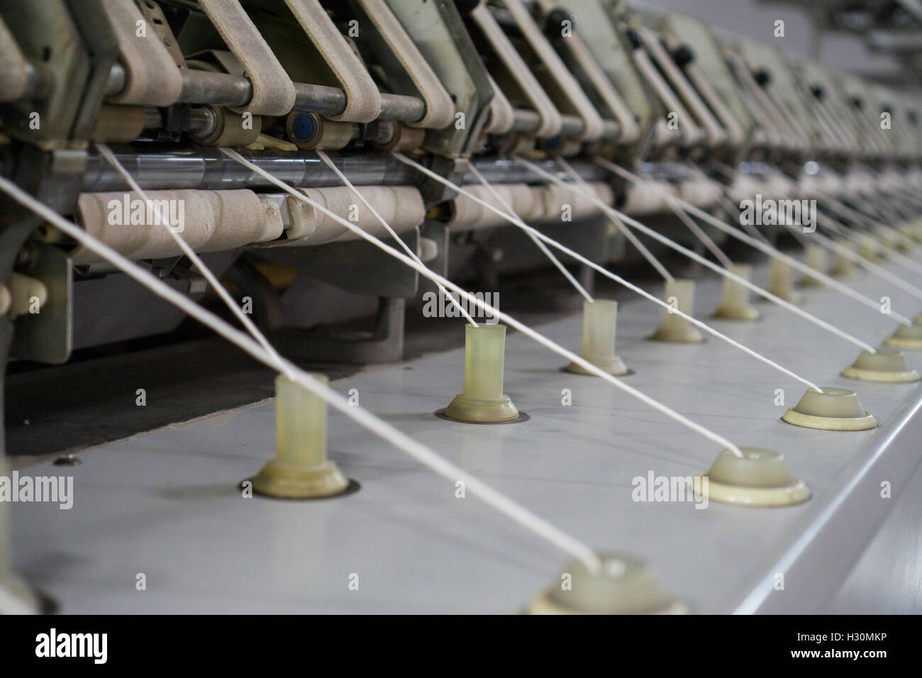 Thread making machine inside cotton mill Multan Pakistan Stock Photo