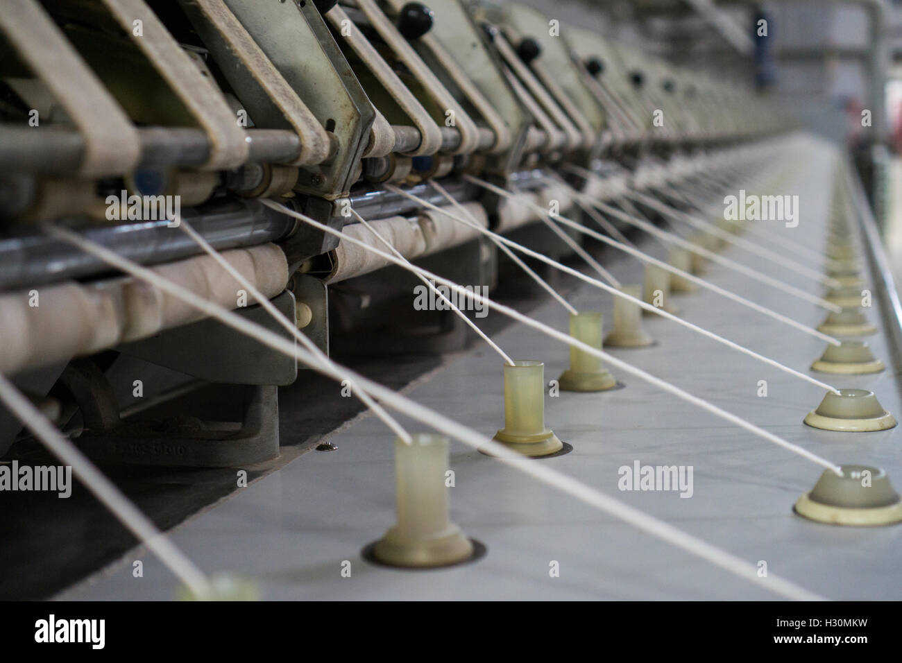 Thread making machine inside cotton mill Multan Pakistan Stock Photo