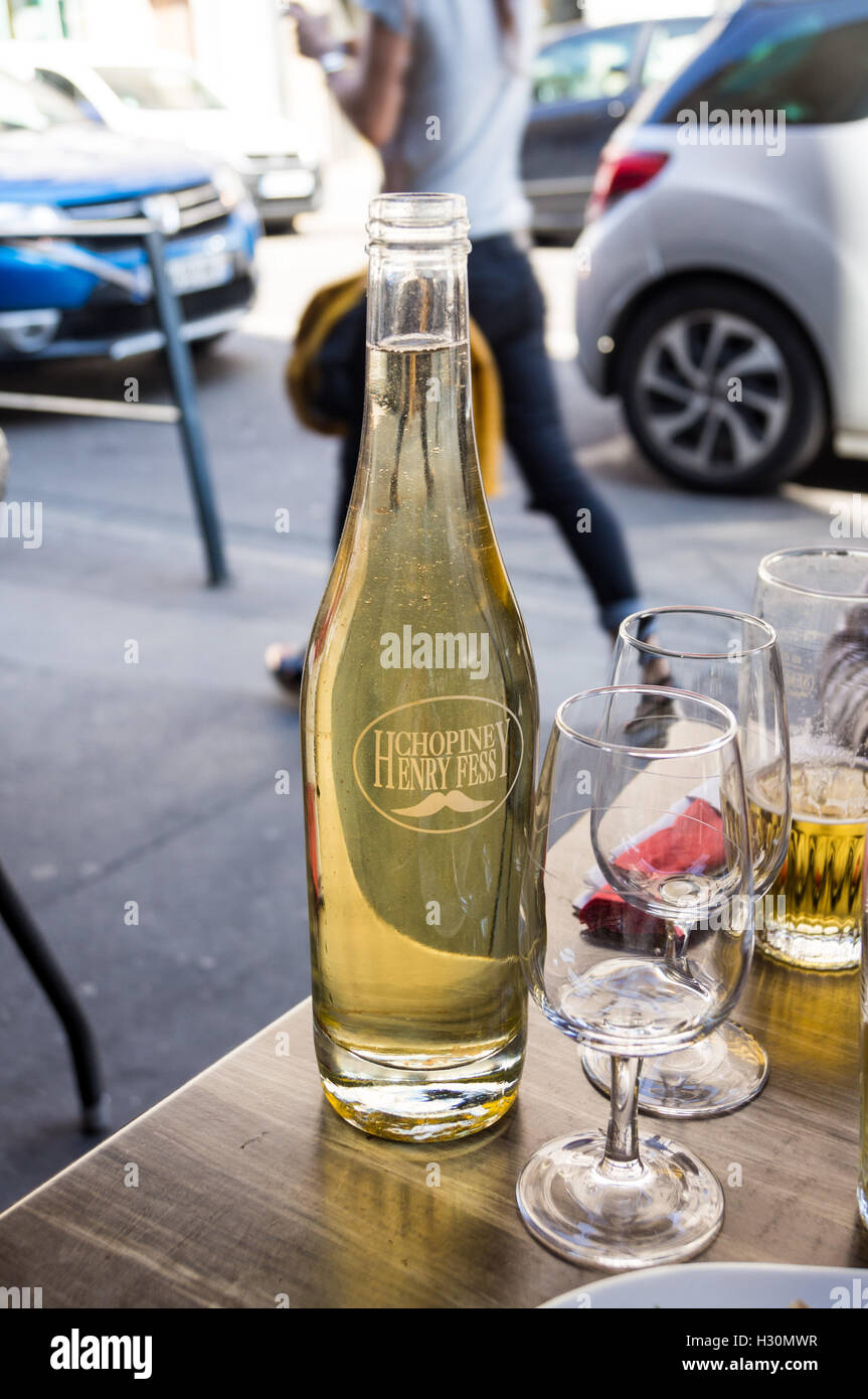A half litre carafe of white wine on a bistro table, Nancy, Meurthe-et-Moselle, France Stock Photo