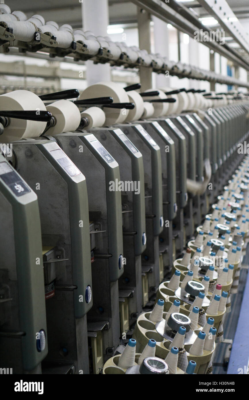 Cotton spools inside cotton mill Multan Pakistan Stock Photo