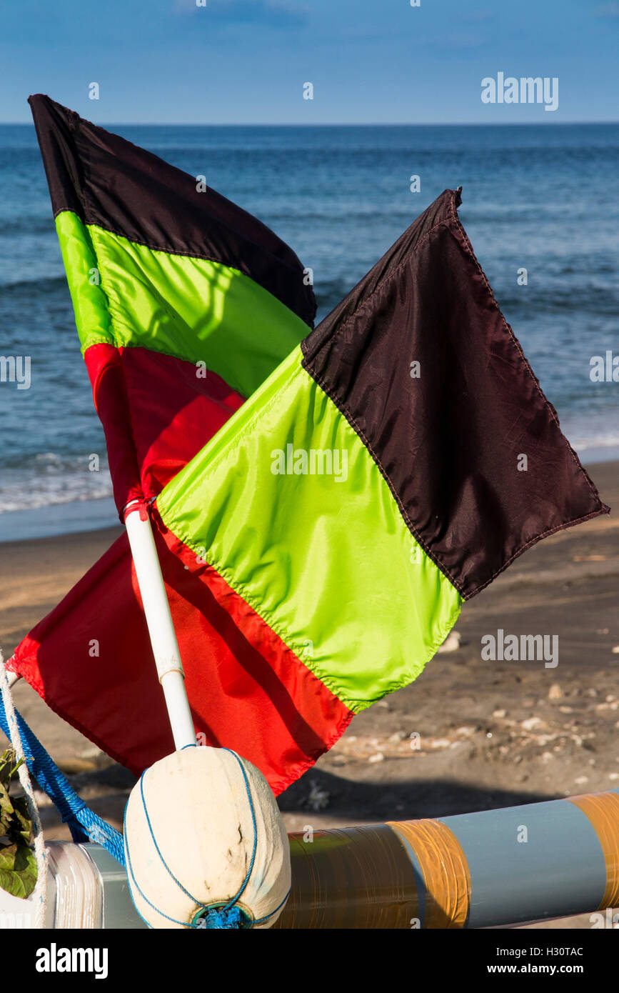 Indonesia, Bali, Amed, beach, fishing float flags on outrigger boats Stock Photo