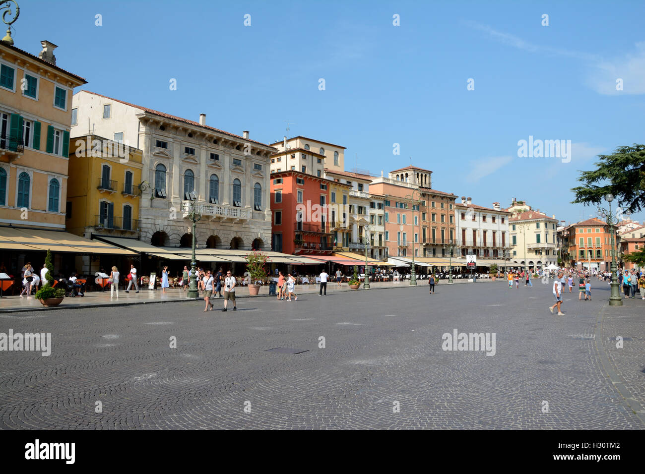 Verona, Italy - September 3, 2016: Buildings on  Piazza Bra square in Verona, Italy. Unidentified people visible. Stock Photo