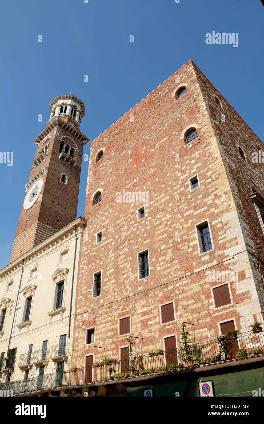 Verona, Italy - September 3, 2016: Torre dei Lamberti tower on Piazza Delle Erbe square in Verona, Italy. Stock Photo