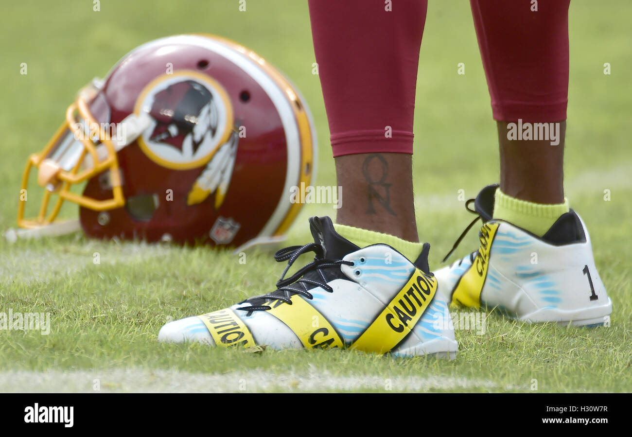 Landover, Maryland, USA. 2nd Oct, 2016. Close-up of the shoes Washington Redskins wide receiver DeSean Jackson (11) is wearing during warm-ups prior to the game against the Cleveland Browns at FedEx Field in Landover, Maryland on October 2, 2016. Earlier in the day, the Redskins released the a statement about Jackson's shoes. Jackson is quoted as saying 'Today is the start of my attempts to be part of a solution and start dialogue about the senseless killings of both citizens and police. I have chosen to wear these cleats in pregame today to use my platform as a pr Stock Photo
