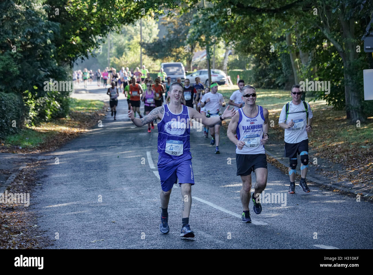 A runner supporting Mind, the mental health charity, participates in the Chester Marathon Stock Photo