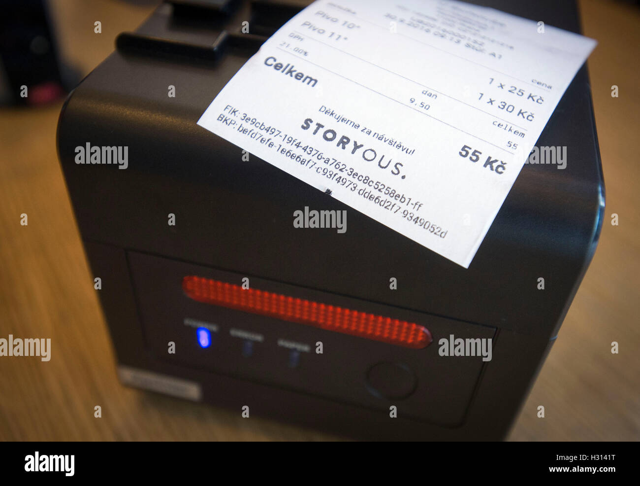 A large part of businesses are leaving the purchase of cash registers for electronic sales registration for the last minute but demand for the equipment has already grown, according to a survey CTK made among companies selling these cash registers.According to the Economic Chamber's latest survey, 43 percent of retailers intend to buy the simplest possible technology whose price starts at Kc5,000 without VAT. In the first stage, electronic registration of sales is to be launched for hotels and restaurants on December 1. Pictured receipt printer and receipt with special code in coffee house in Stock Photo