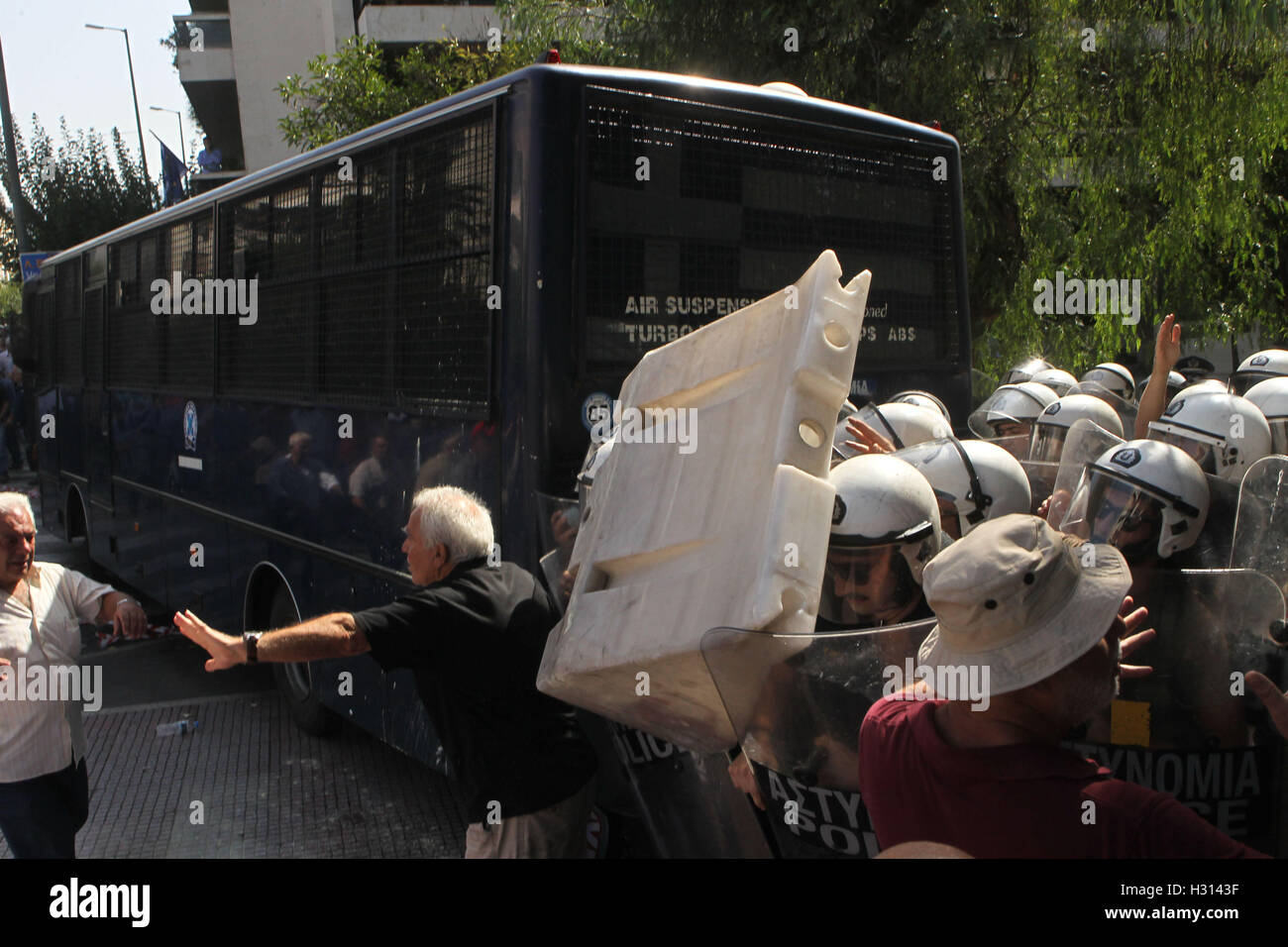 Athens, Greece. 3rd Oct, 2016. Elderly people clash with riot police during anti-austerity protest against pension cuts in central Athens near the prime minister's office. Credit:  Aristidis Vafeiadakis/ZUMA Wire/Alamy Live News Stock Photo