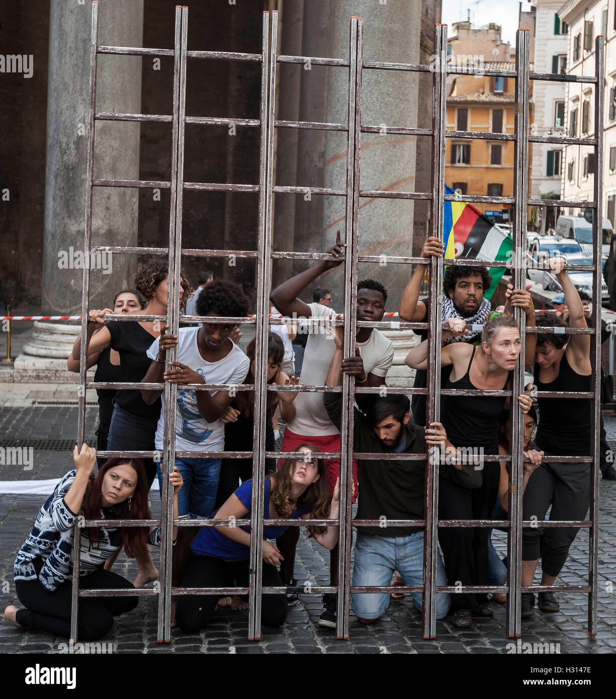 Rome, Italy. 03rd October, 2016. Members of ARCI association hold a 'flashmob' in Pantheon Square to remember the victims of immigration in Rome, Italy on October 03, 2016. The Italian Republic recognises 3 October as National Day in memory of the victims of immigration, commemorating those “who lost their lives trying to emigrate towards our country to escape wars, persecution and poverty”. The day is chosen to pay respect to the 366 migrants who drowned on October 3 2012 in the Mediterranean in view of the Sicilian Island of Lampedusa. Credit:  Giuseppe Ciccia/Alamy Live News Stock Photo