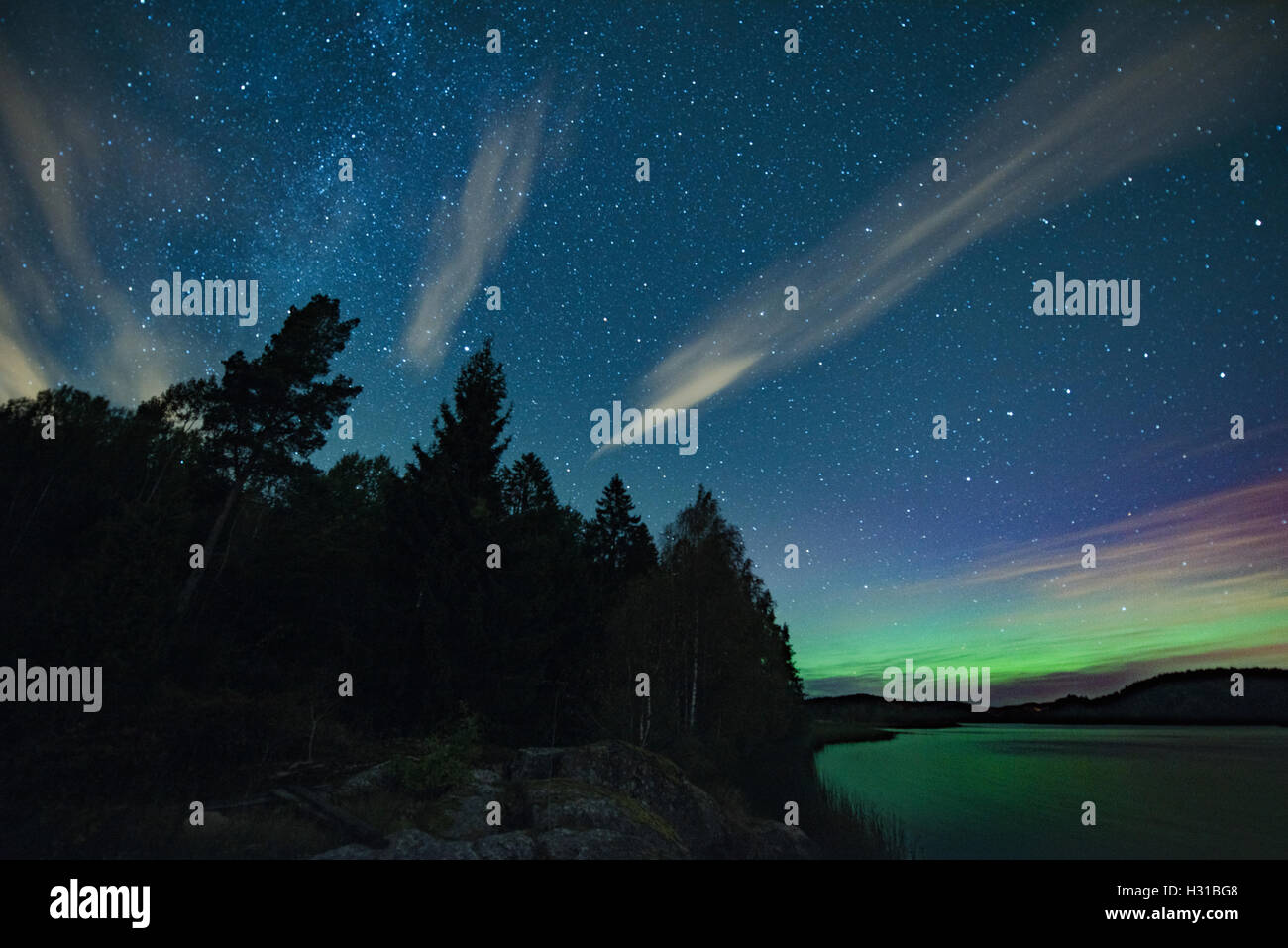 Aurora borealis and the starry sky on the Goksjo lake in Norway Stock ...