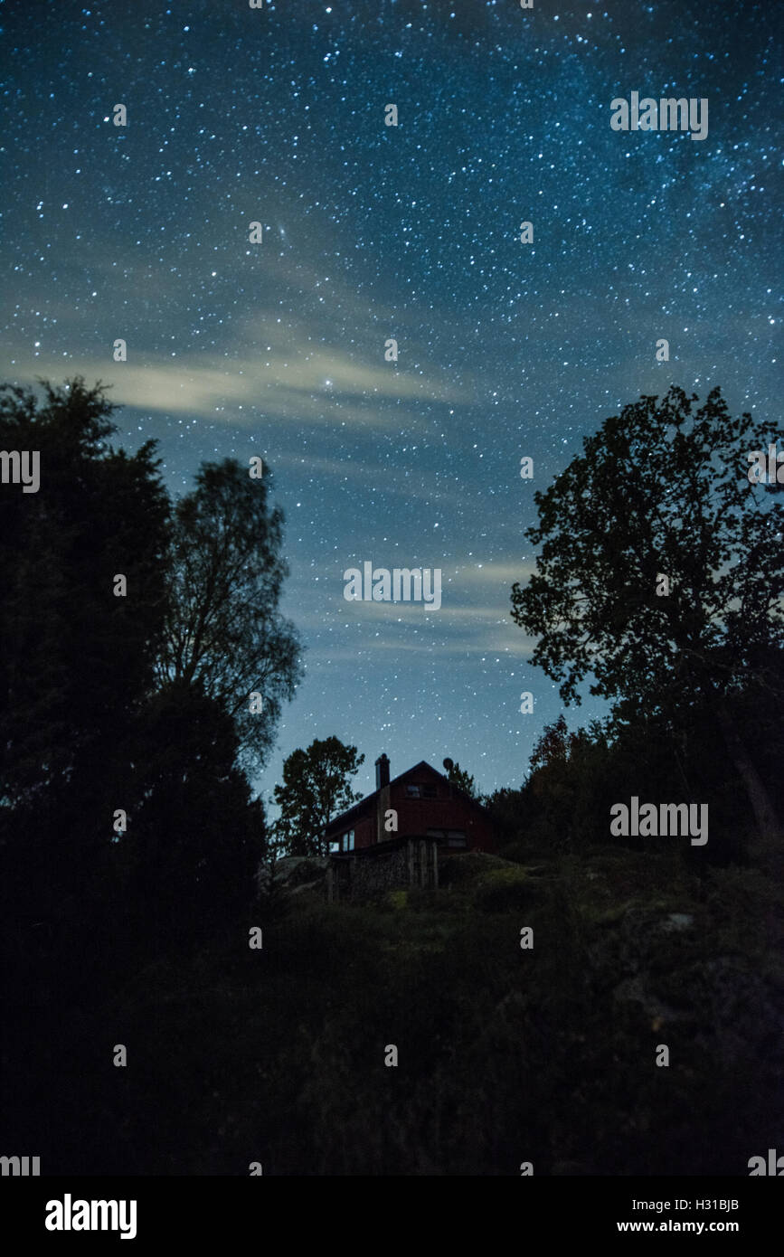 Little house at the night with the starry sky Stock Photo - Alamy