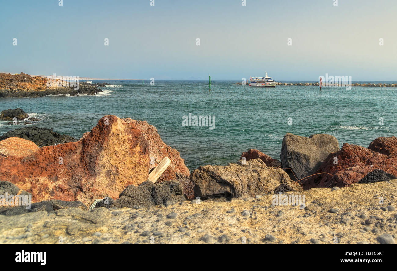 Blue boat on rocky shore hi-res stock photography and images - Alamy