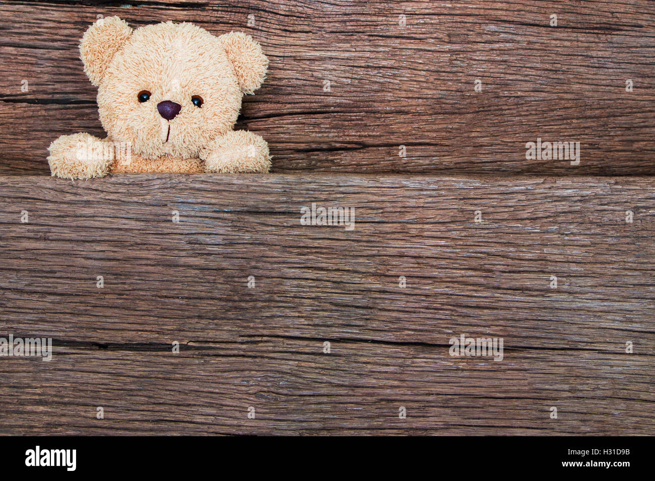 Cute teddy bears on old wood background with copy space Stock Photo - Alamy