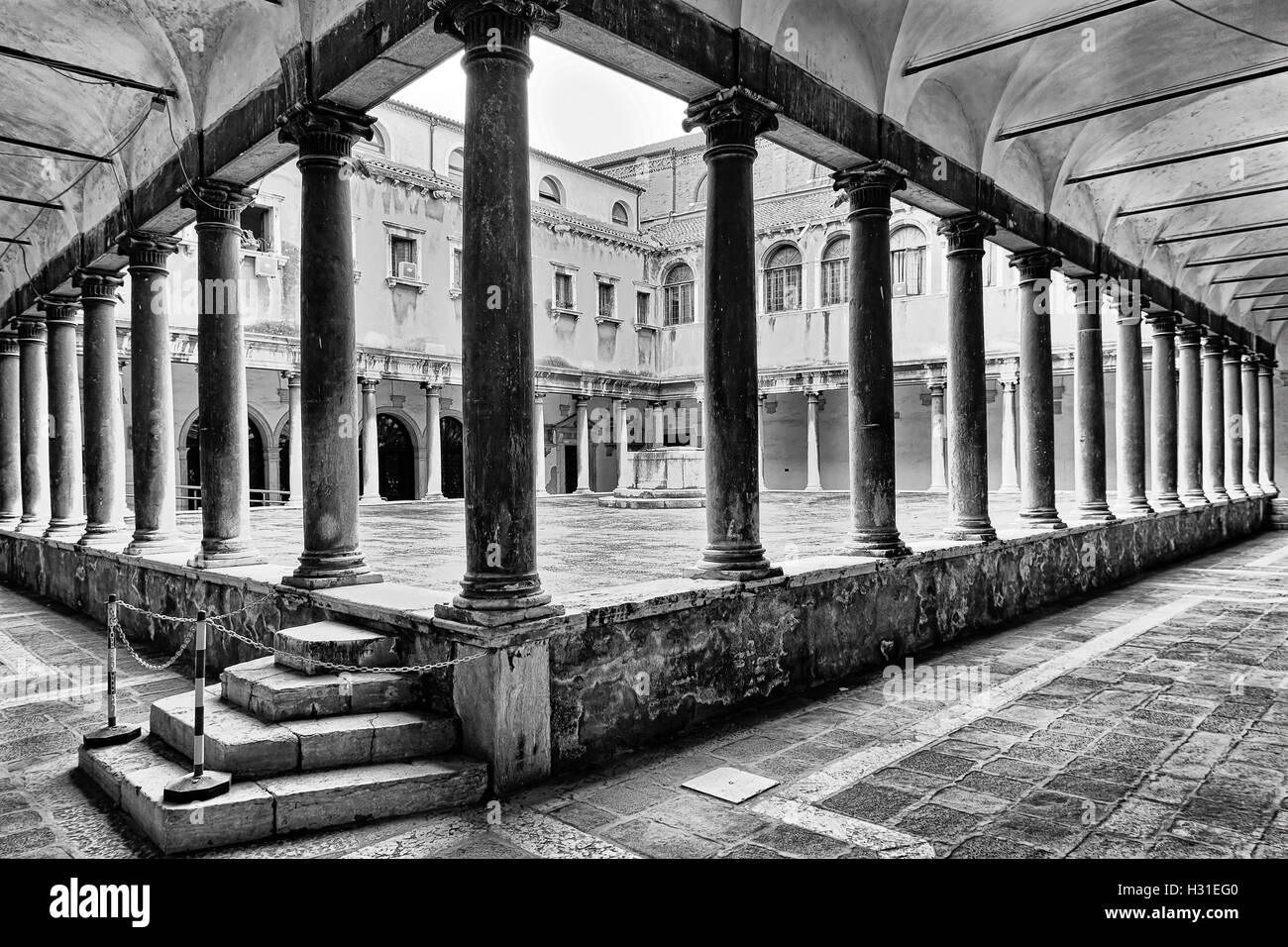 Inner courtyard of historic wealthy italian palaces - Doge's palace in Venice city of ancient republic. Empty space surrounded Stock Photo