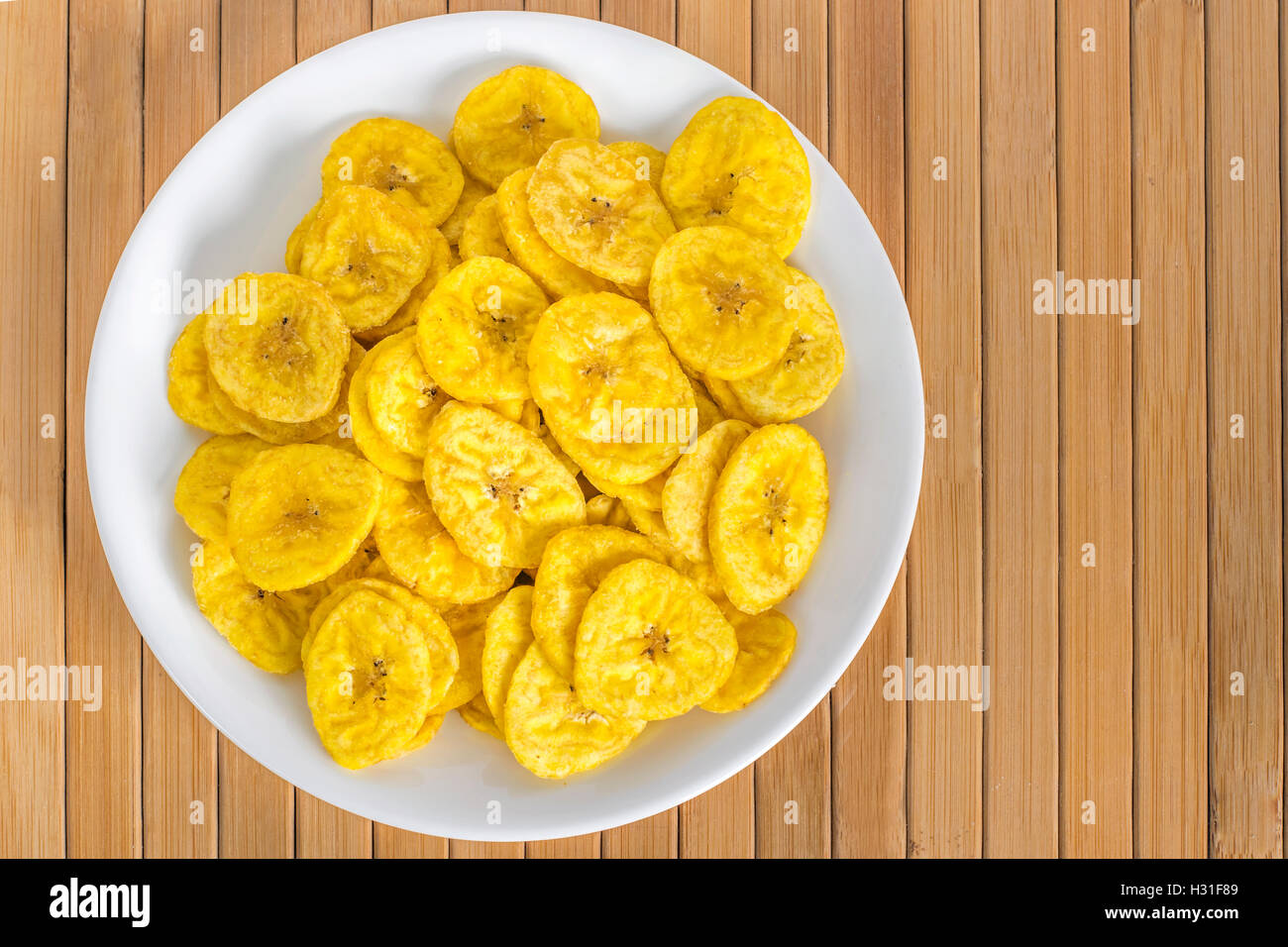 Fried banana chips in a white plate Stock Photo Alamy
