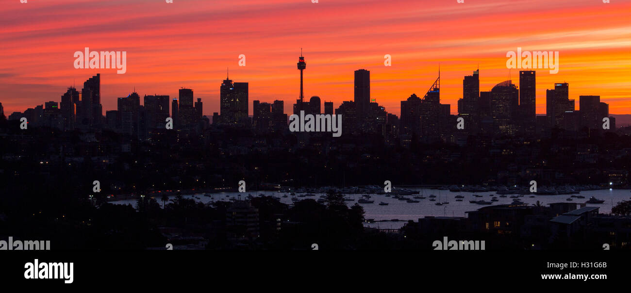 Silhouette of Sydney CBD Central Business District skyline at sunset Sydney NSW Australia Stock Photo