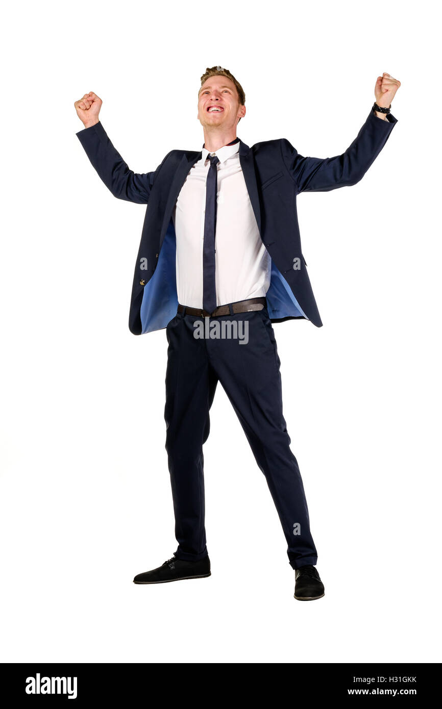 Happy young businessman raised fists Stock Photo - Alamy