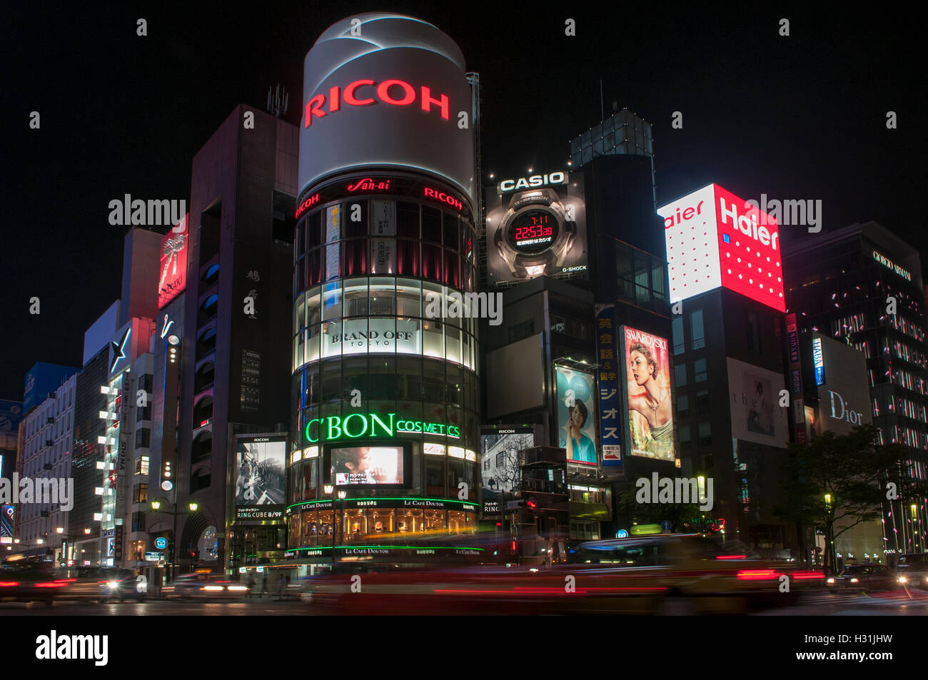 Night view of the busy intersection of Chuo-dori with Yon-chome crossing in Ginza, often called 4-chome intersection in Ginza district Tokyo. Stock Photo