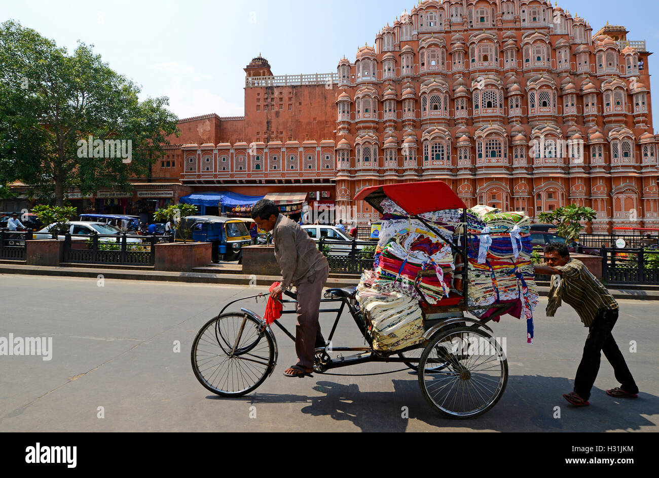Cycle Rickshaw in front of Hawa Mahal in Jaipur,India Stock Photo