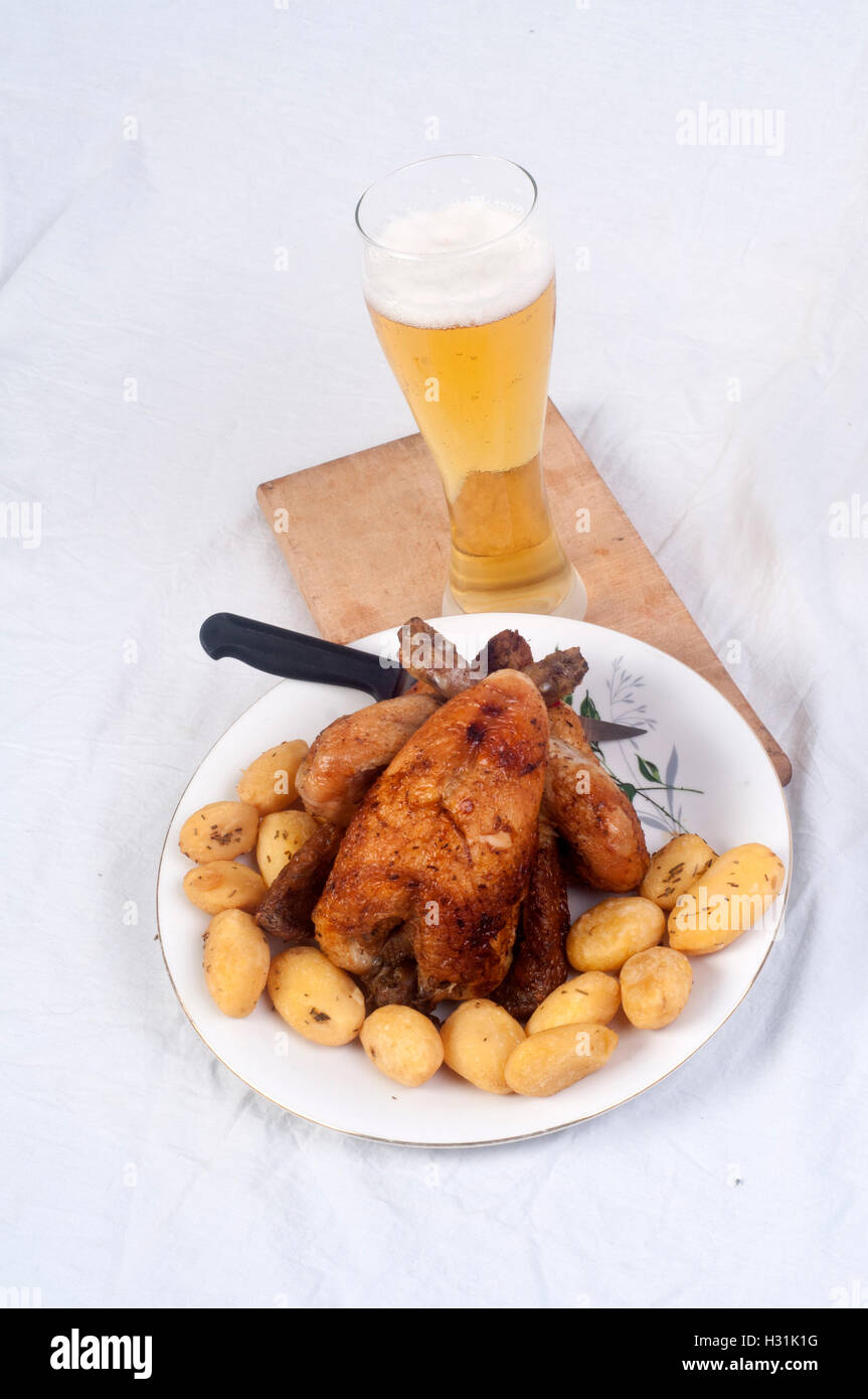 Chicken, roasted and potatoes Stock Photo - Alamy