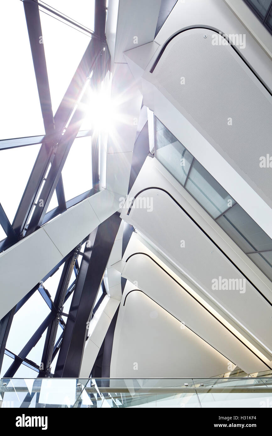 Looking up at the internal structure and floors of The Gherkin with the sun shining in. Office Space at The Gherkin, London, United Kingdom. Architect: IOR GROUP Interiors, Foster + Partners, 2016. Stock Photo