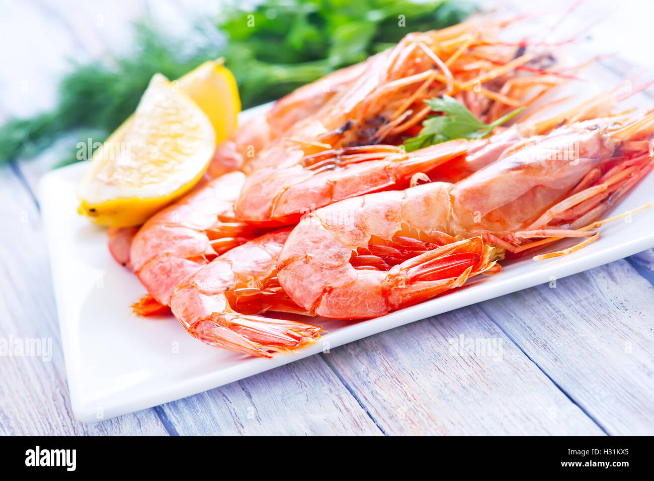 boiled shrimps on plate and on a table Stock Photo - Alamy
