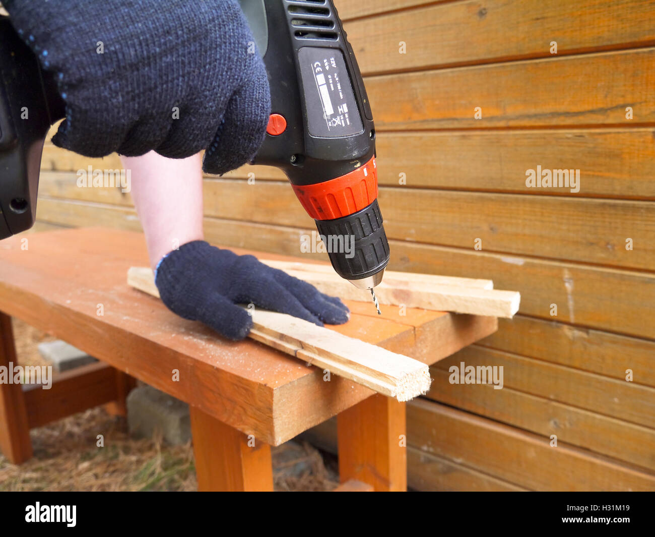Man uses electric drill Stock Photo Alamy