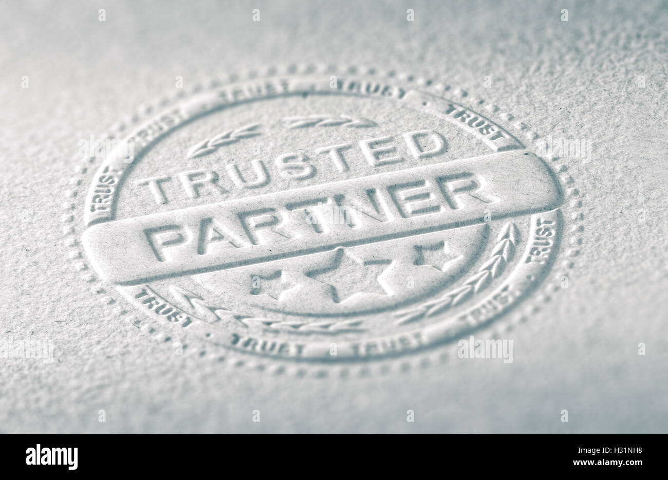 3D illustration of an embossed stamp with the text trusted partner, Paper background and blur effect. Concept of confidence in b Stock Photo