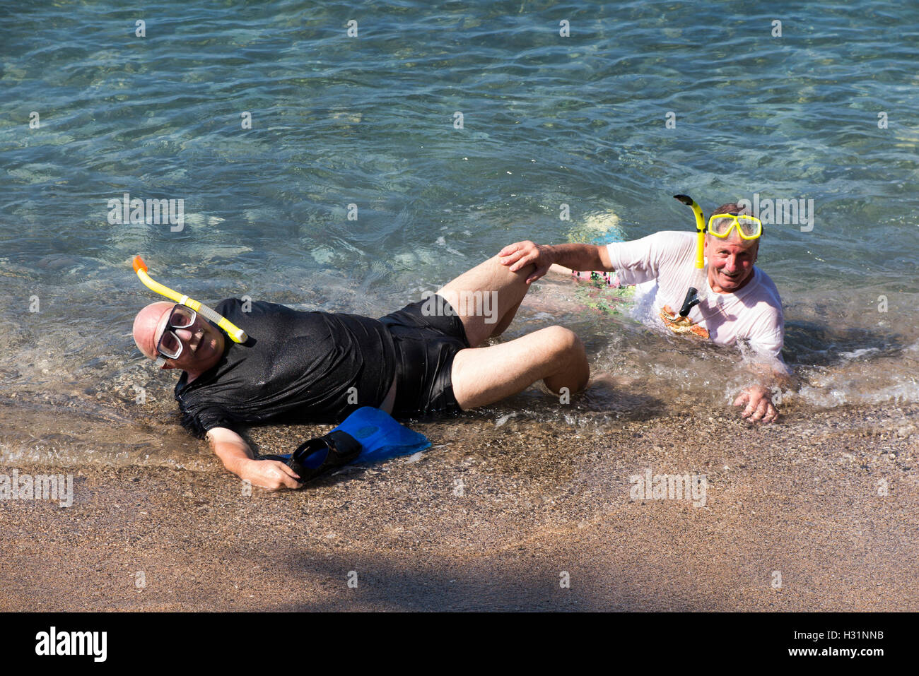Indonesia, Bali, Amed, snorkeling, two tourist snorkellers lying in sea Stock Photo