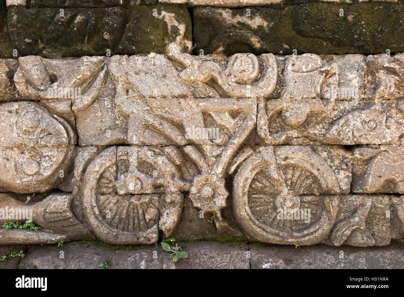 Indonesia, Bali, Sawan, Jagaraga, Pura Dalem temple, exterior carved relief image of bicycle Stock Photo