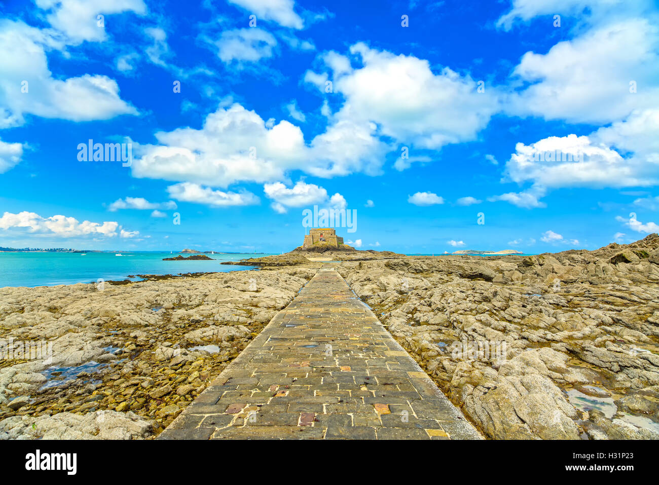 Saint Malo, Petit Be Fort and stone pathway during Low Tide. Brittany, France, Europe. Stock Photo