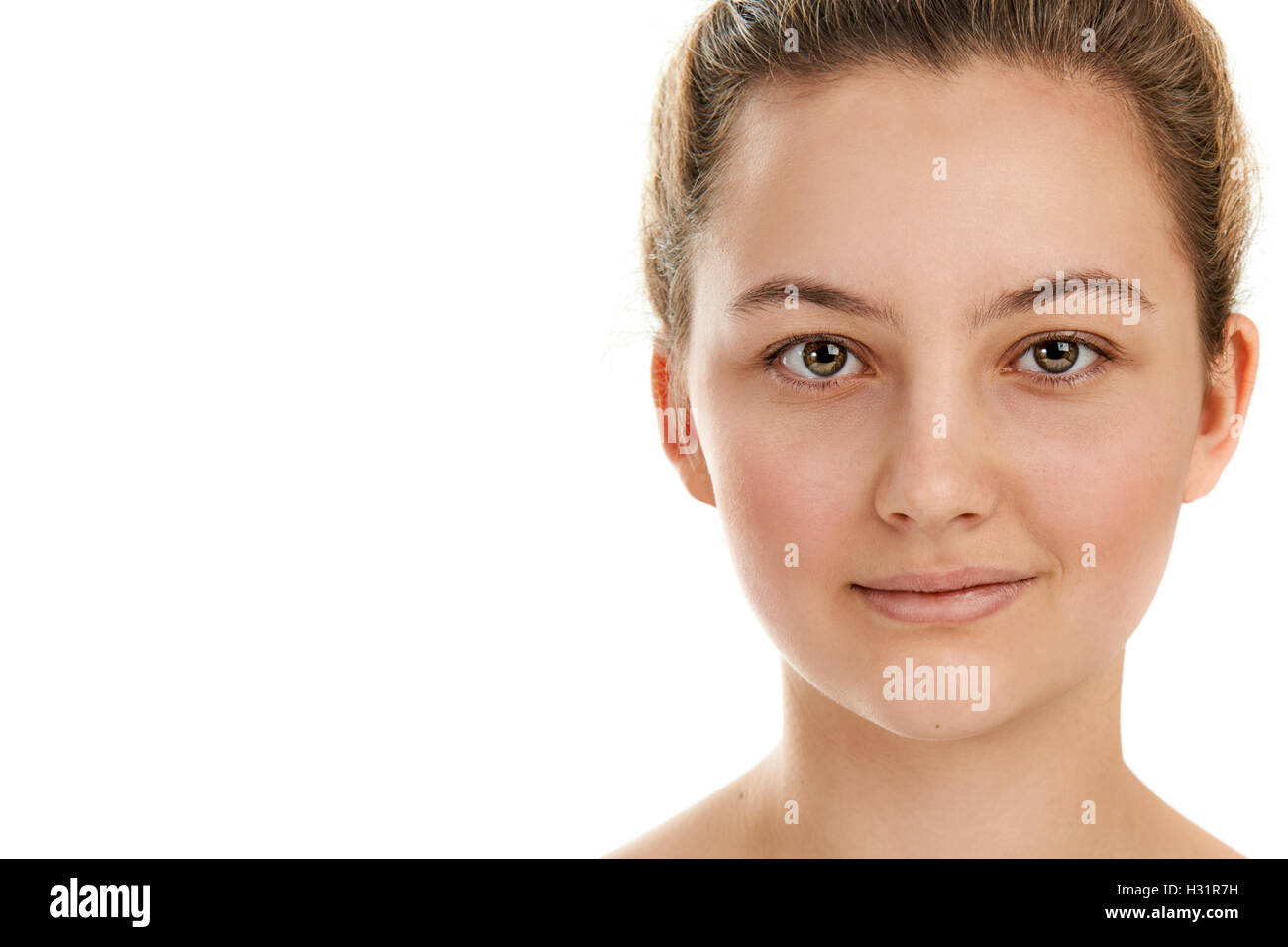 Portrait of a beautiful young woman close up on a white background ...