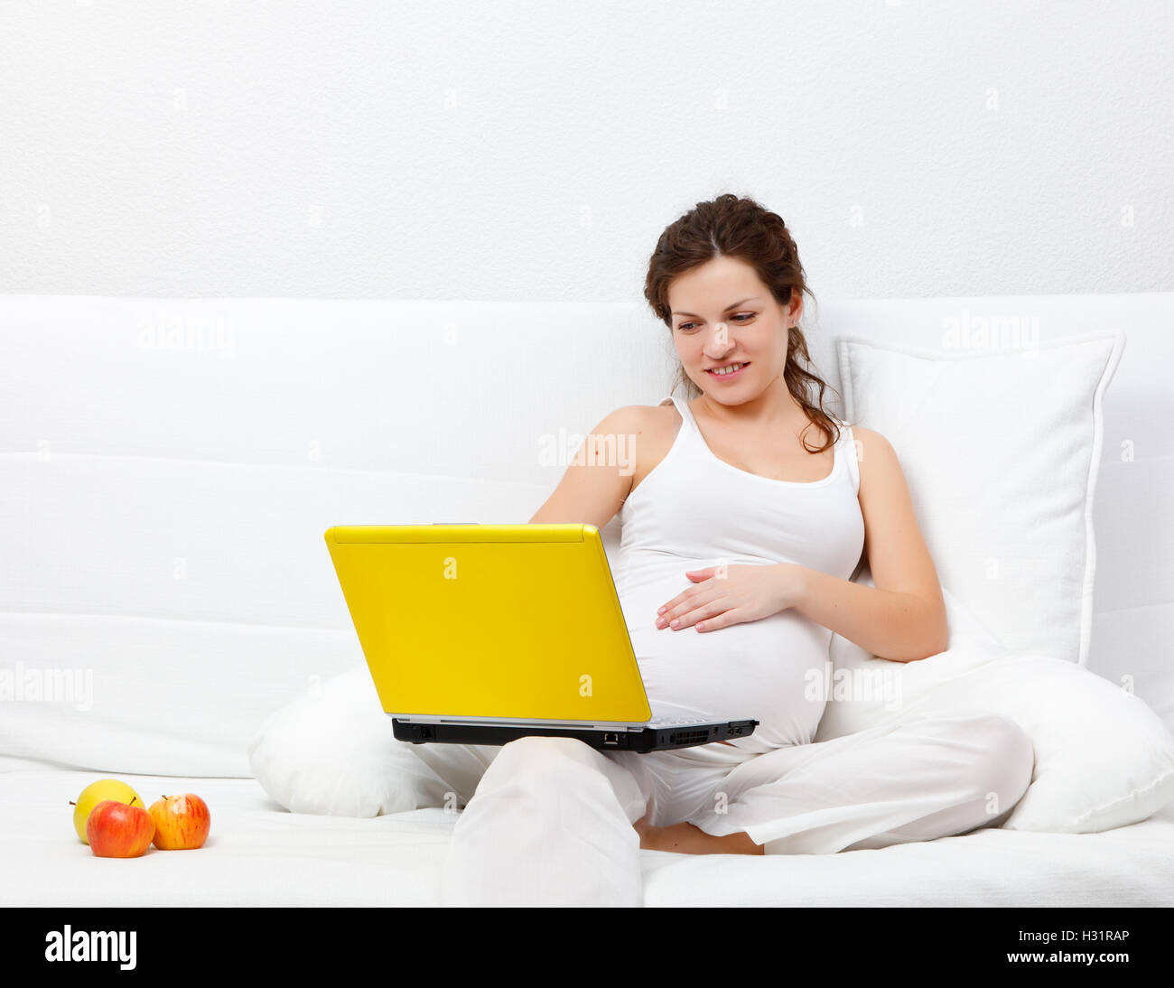 Young pregnant woman with a laptop Stock Photo Alamy
