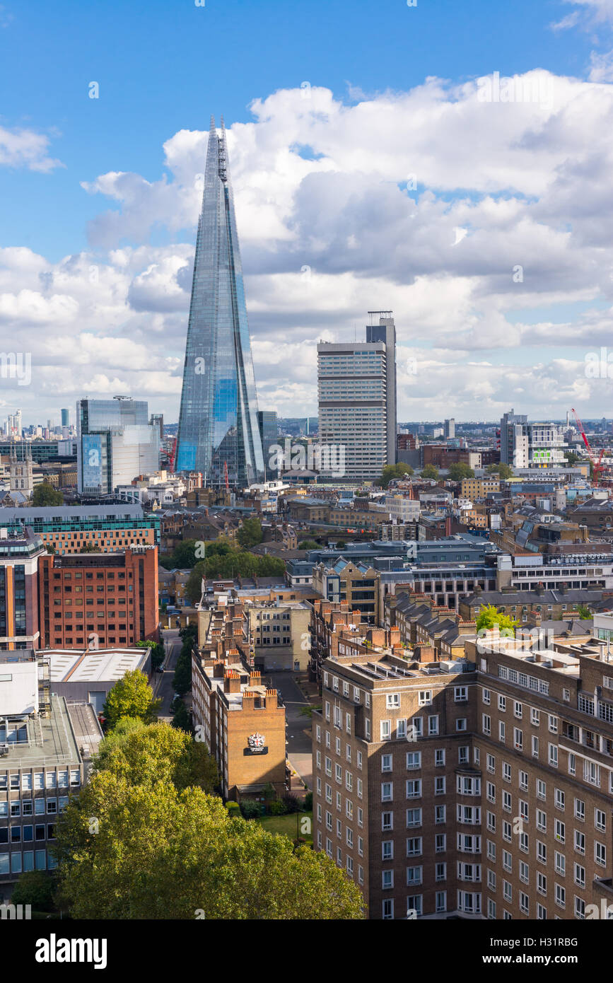 The Shard and Guy's Hospital with Canary wharf in the distance. Taken from the Tate Modern New Switch building top floor terrace Stock Photo