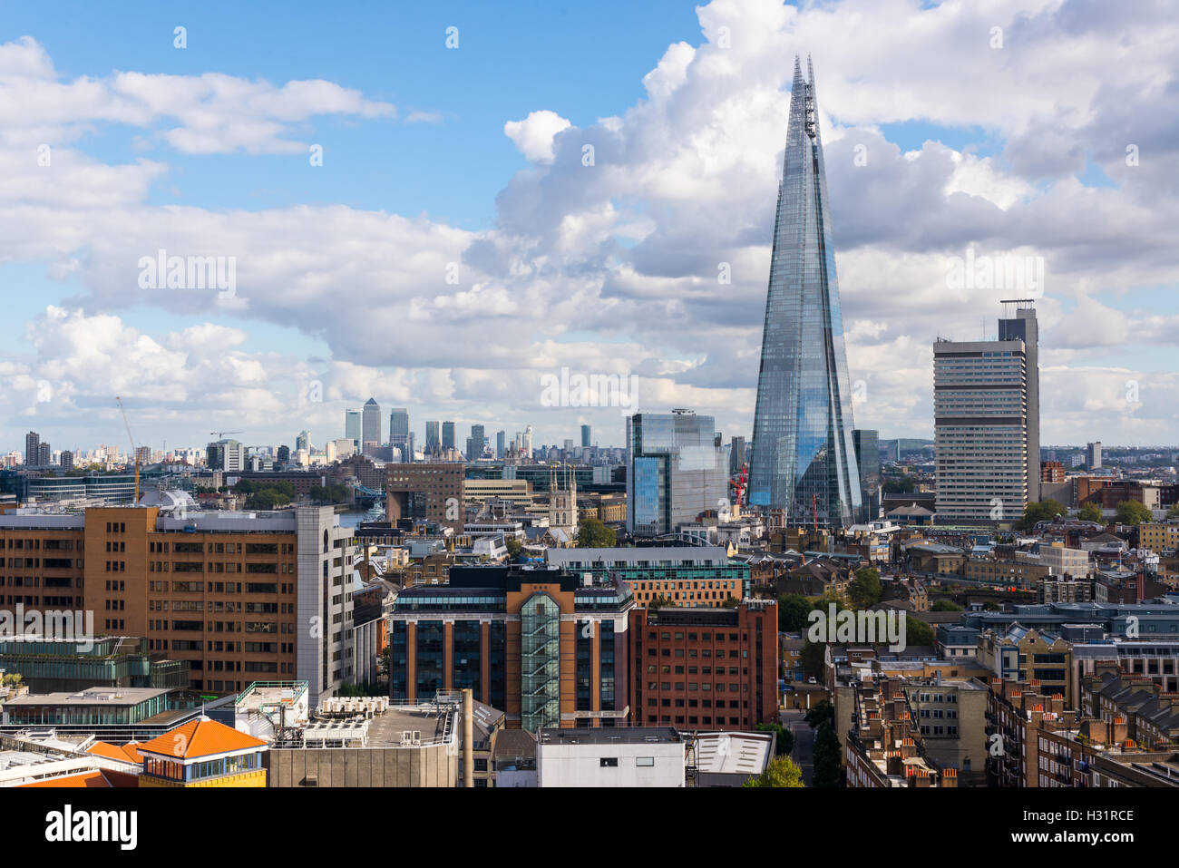The Shard and Guy's Hospital with Canary wharf in the distance. Taken from the Tate Modern New Switch building top floor terrace Stock Photo