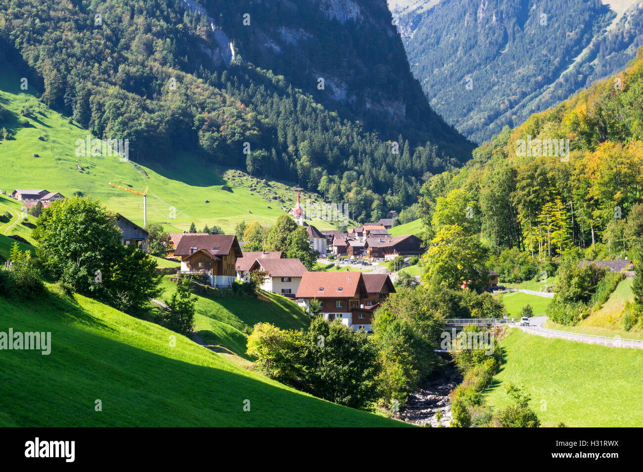 Isenthal, a small village in a valley in the Swiss Alps. Canton of Uri, Switzerland. Stock Photo
