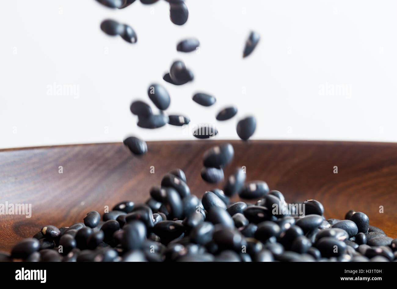 Dried Black Beans Falling Stock Photo Alamy