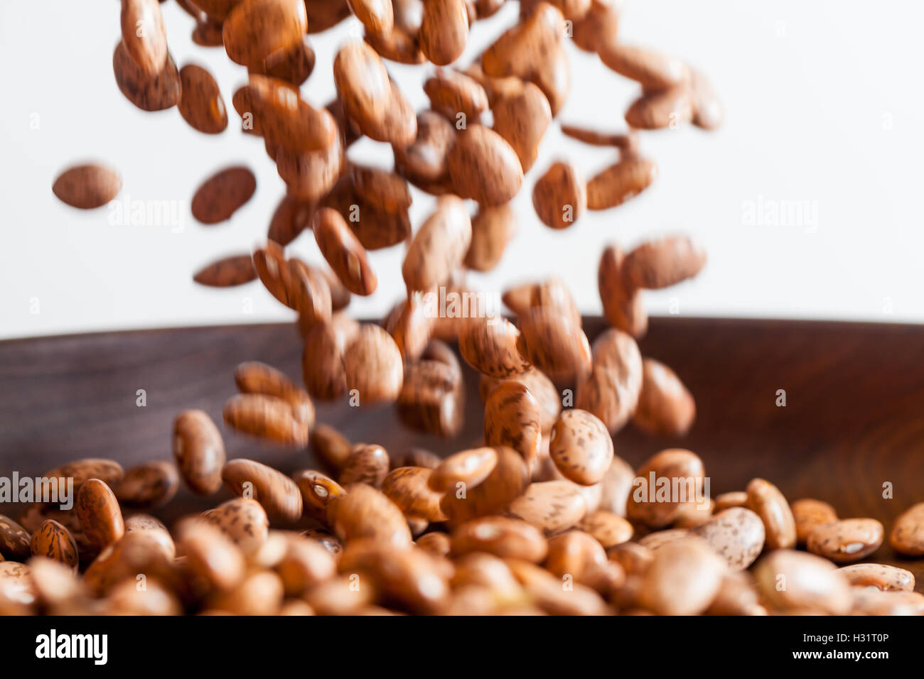 Dried Pinto Beans Falling Stock Photo Alamy