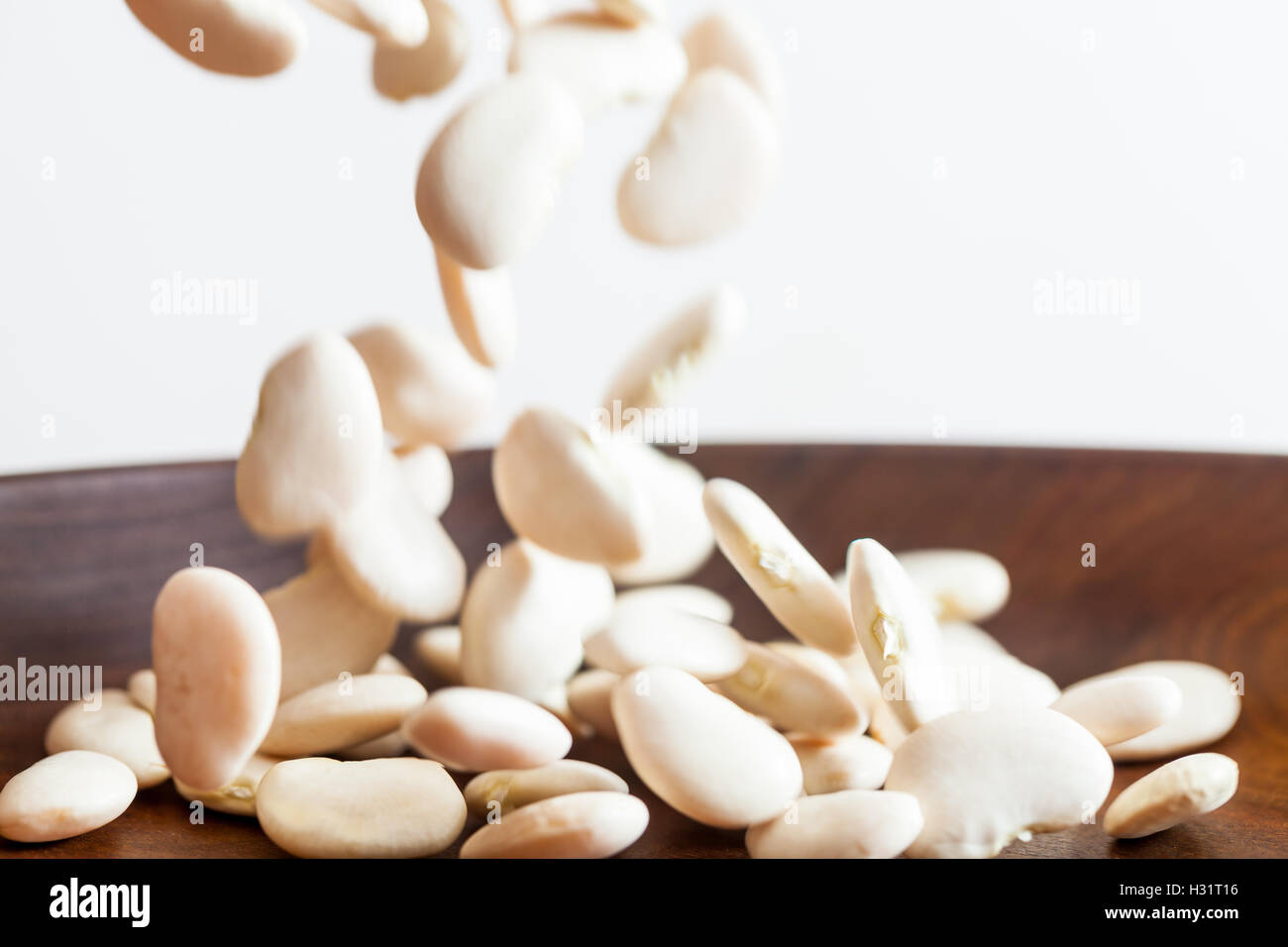 Dried Butter Beans Falling Stock Photo Alamy