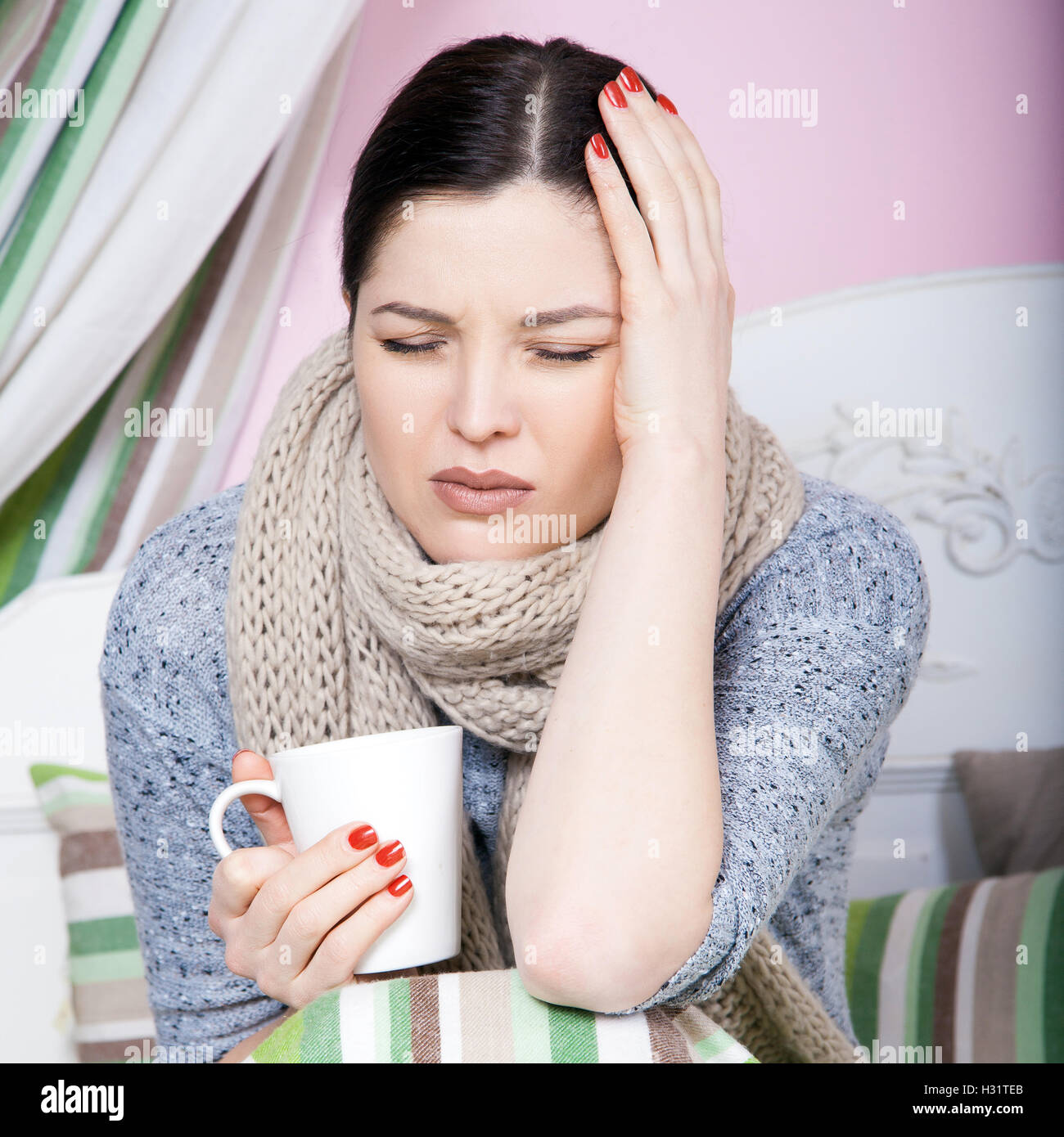 Young beautiful sick woman feeling ill and bad lying on bed suffering
