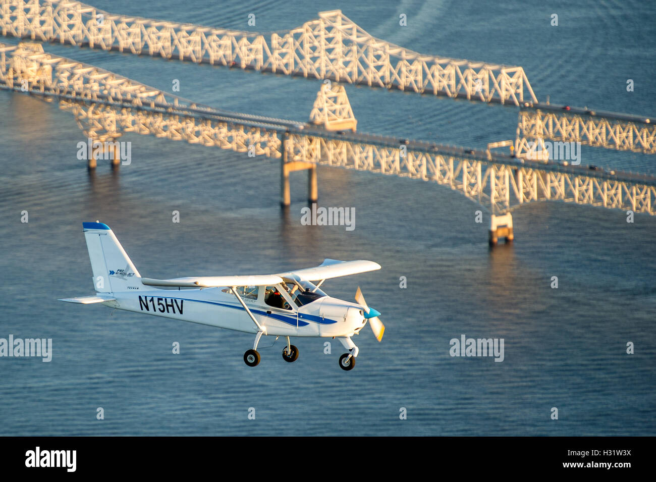 Chesapeake Sport pilot aircraft, Technam Eaglet, RV-12 flying over the Chesapeake Bay Bridge in Maryland. Stock Photo