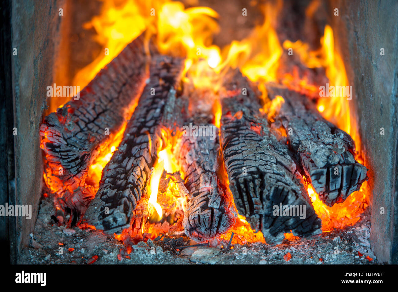 Logs burning in a fireplace in Gorham, Maine Stock Photo