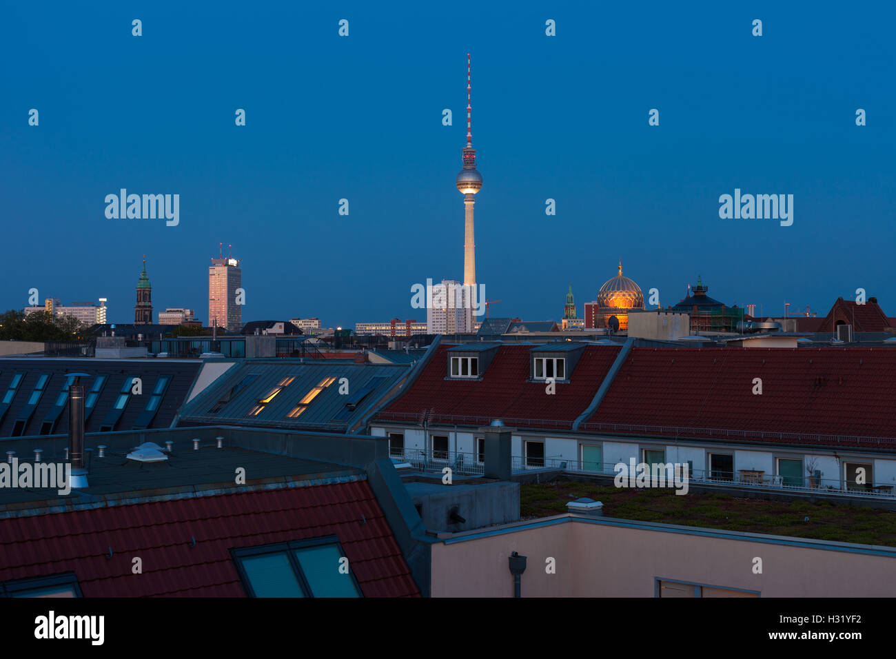 Berlin skyline with Fernsehturm (TV Tower), Neue Synagogue, and townhomes Stock Photo