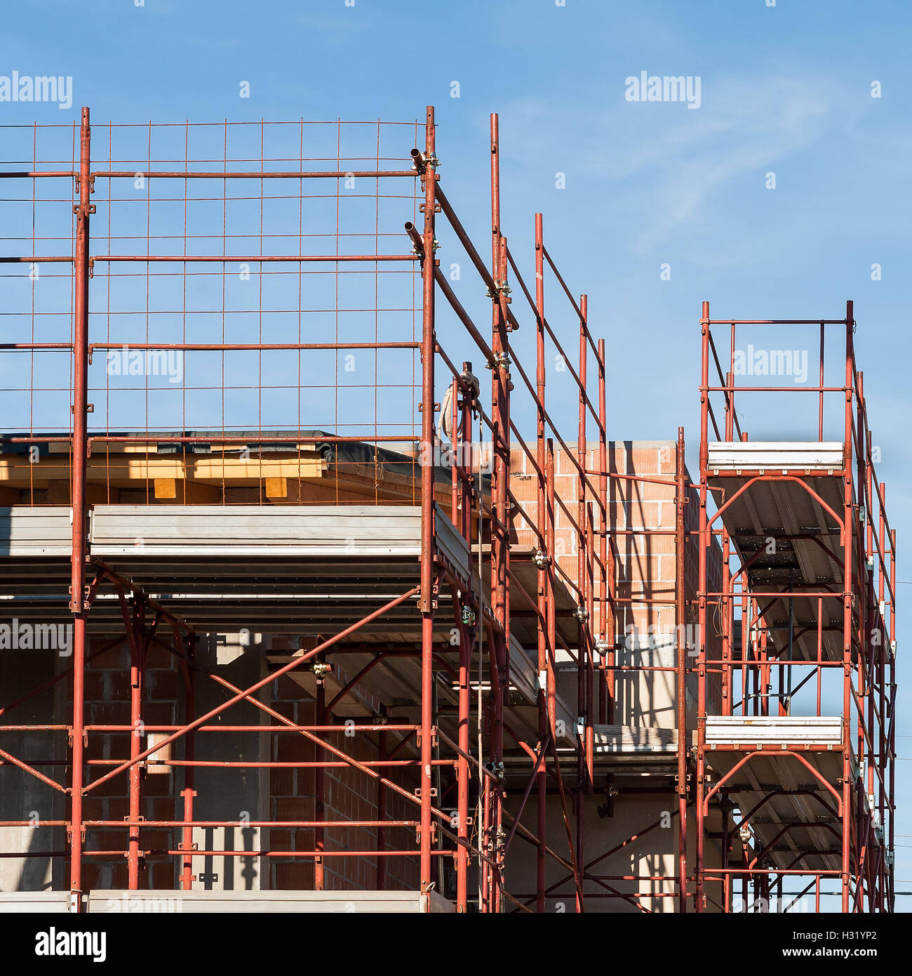 House under construction with the scaffolding for bricklayers Stock