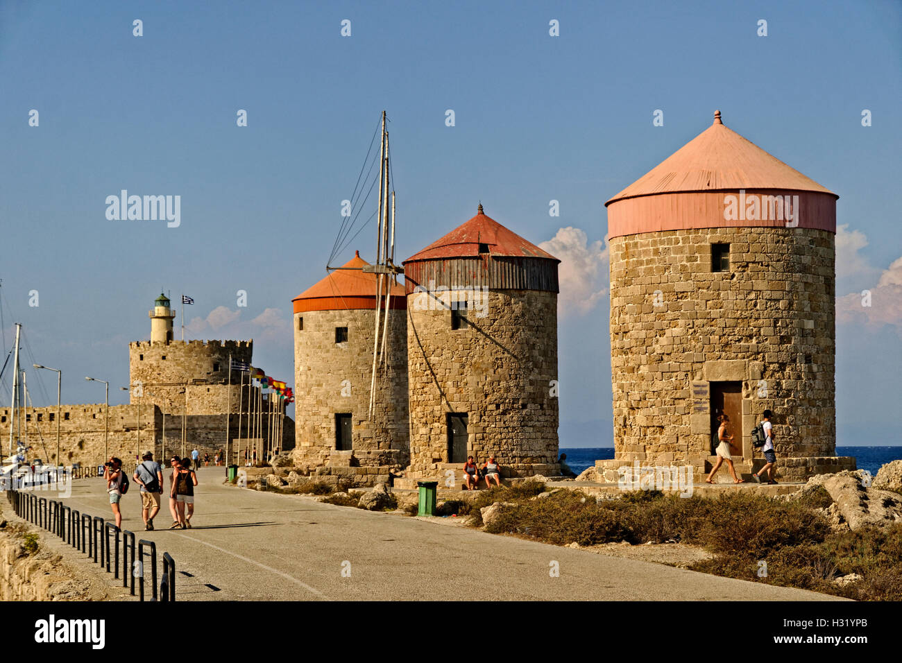 Old windmills at Rhodes city harbour, Island of Rhodes, Dodecanese island group, Greece. Stock Photo