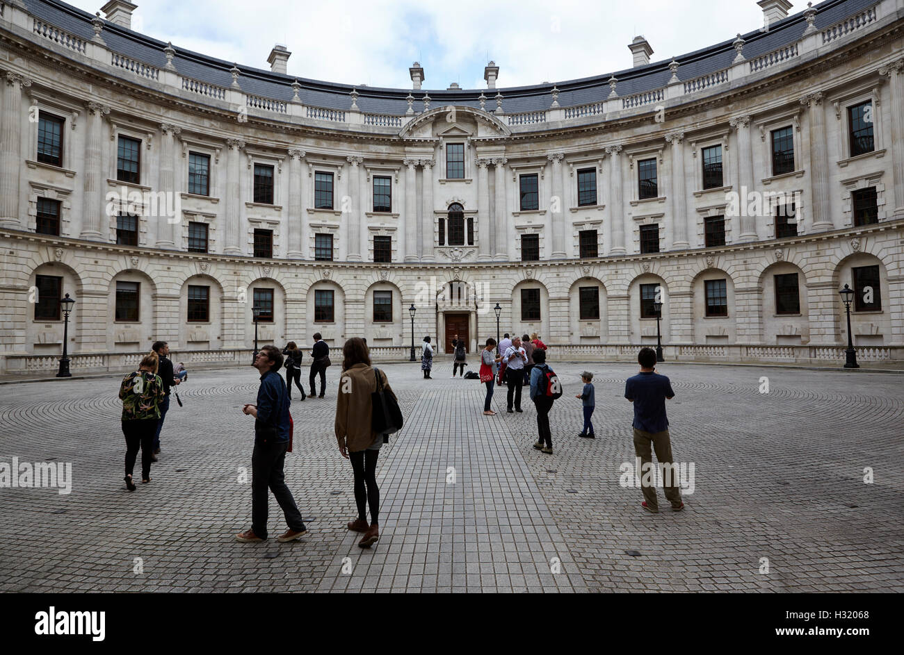 Tourists visit courtyard of HM Treasury London UK Stock Photo