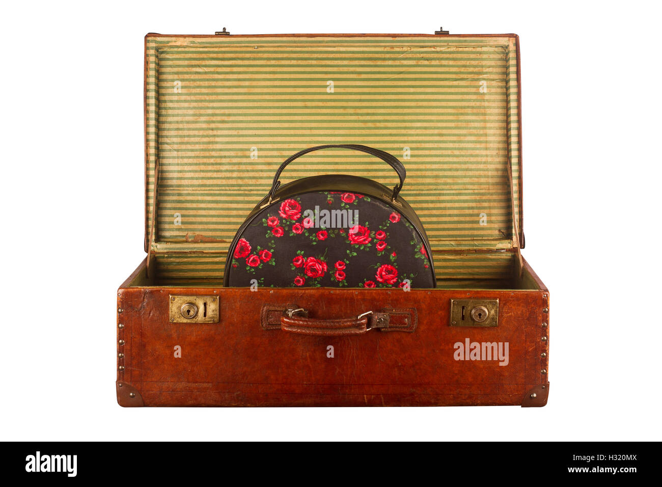 Old vintage open suitcase with roses themed hand luggage isolated on white background Stock Photo