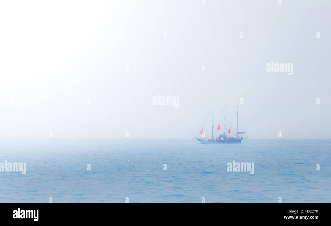 Nice ship with scarlet sails on sea horizon Stock Photo - Alamy