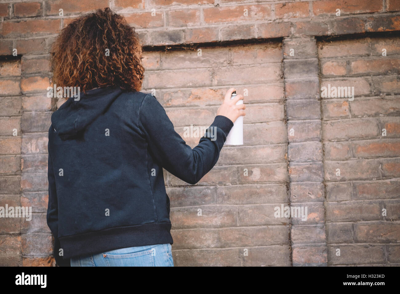 Woman Spray Paint High Resolution Stock Photography and Images - Alamy