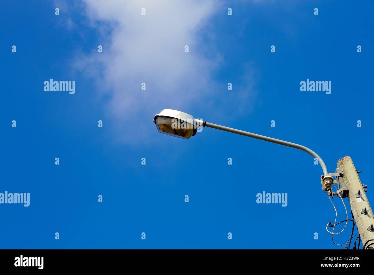 Lighting poles on blue sky background Stock Photo Alamy