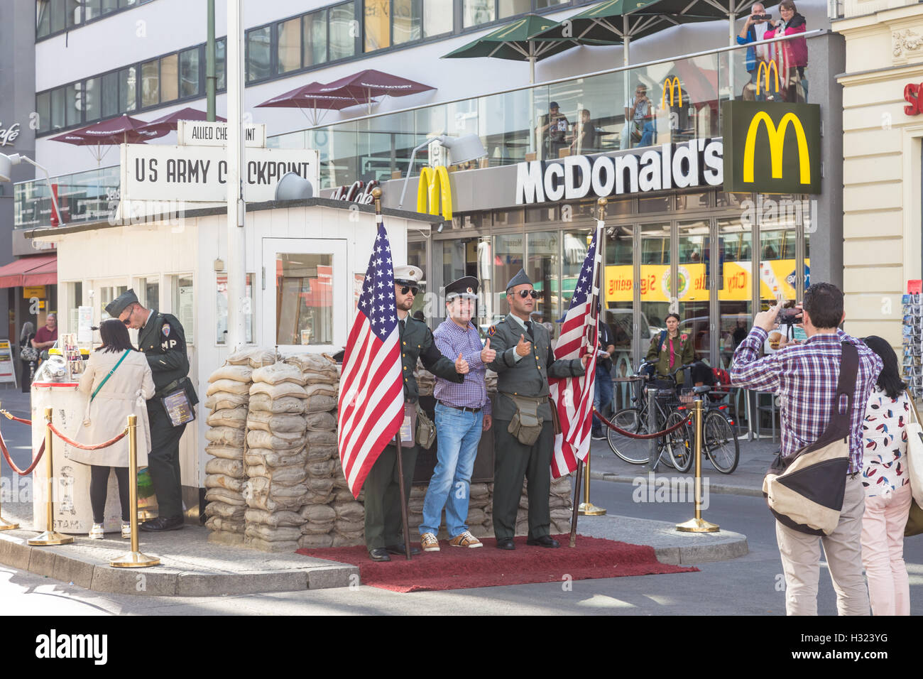 People taking pictures and selfies at check point Charlie, Berlin, Germany. Stock Photo